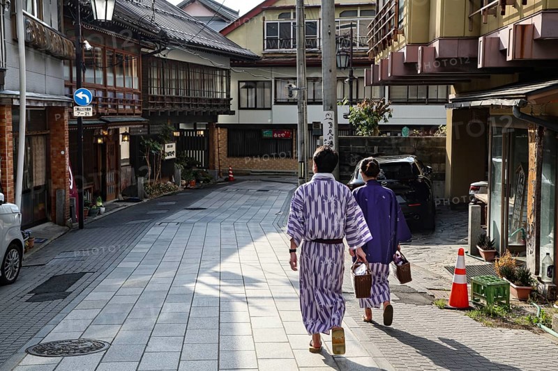 Yukata bathers stroll the quiet streets of Yamanouchi, Yamanouchi, Japan