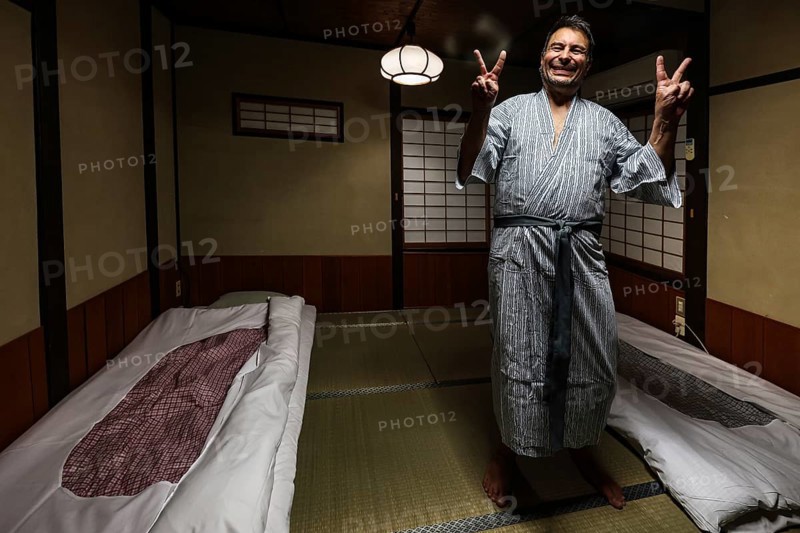 Person in yukata in traditional Japanese room with tatami mats, Takayama, null, Japan