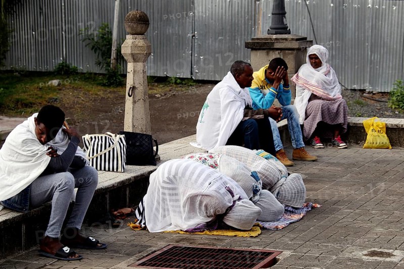 People gather praying in front of a church in Addis Ababa, Addis Ababa, Ethiopia