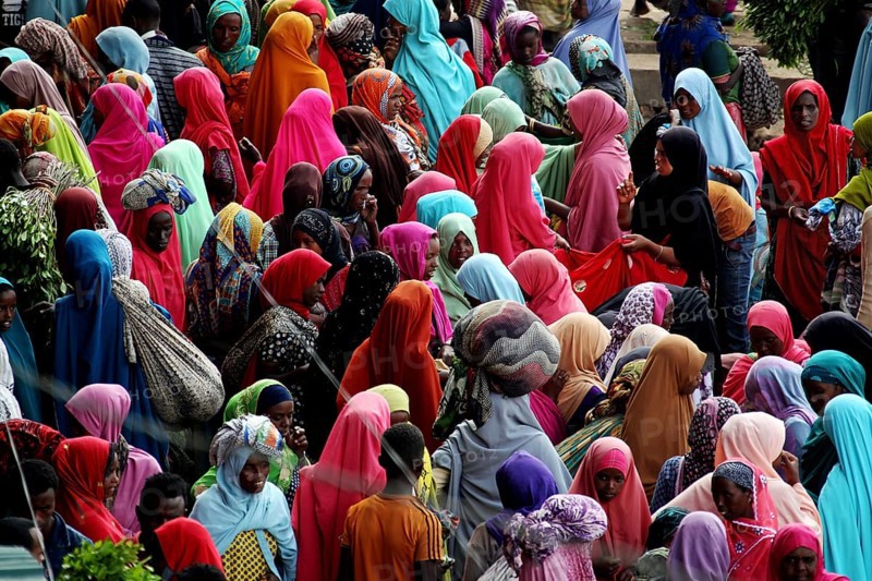 Large crowd in colorful clothes at a market in Awaday, Awaday, Ethiopia