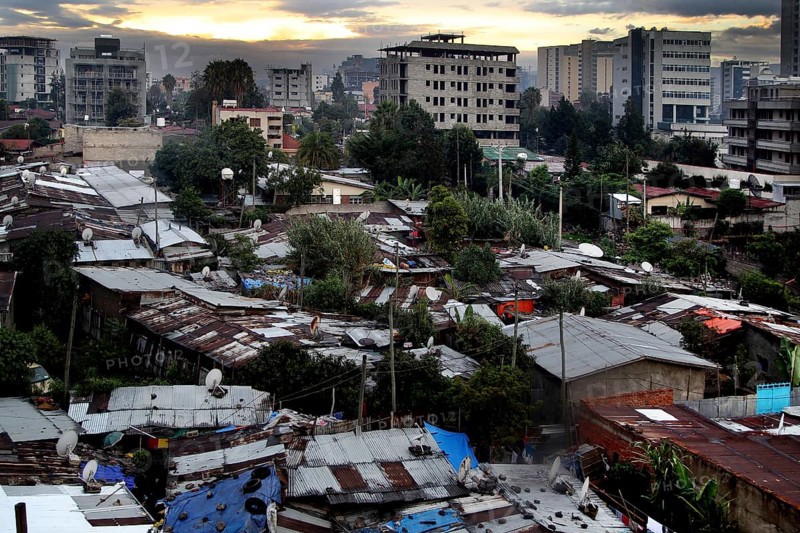View of buildings and vegetation with dramatic evening sky, Addis Ababa, Ethiopia