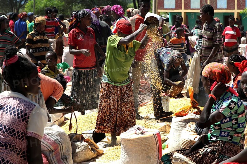 Active market in Konso with people in traditional clothes exchanging goods, Konso, region, Ethiopia