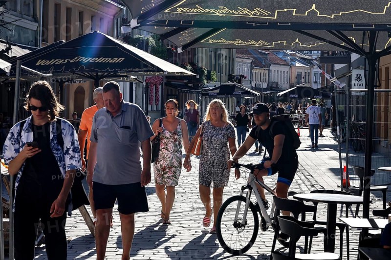 Vilnius Gatve in Kaunas with passers-by and cyclists in the summer sun, Kaunas, null, Lithuania