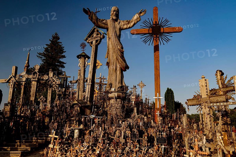 Hill of Crosses in Siauliai with countless crosses and religious symbols in the evening light, Siauliai, Lithuania