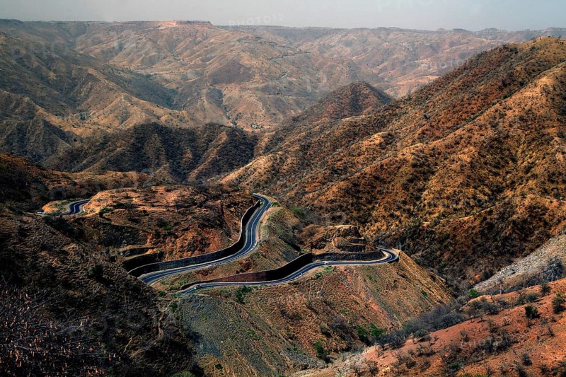 Serpentine road snakes through the barren Semien Mountains