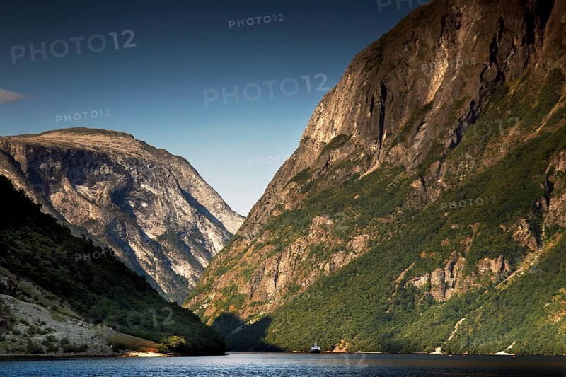 Majestic panorama of Nærøyfjord near Gudvangen with high mountains and still water, Gudvangen, Norway