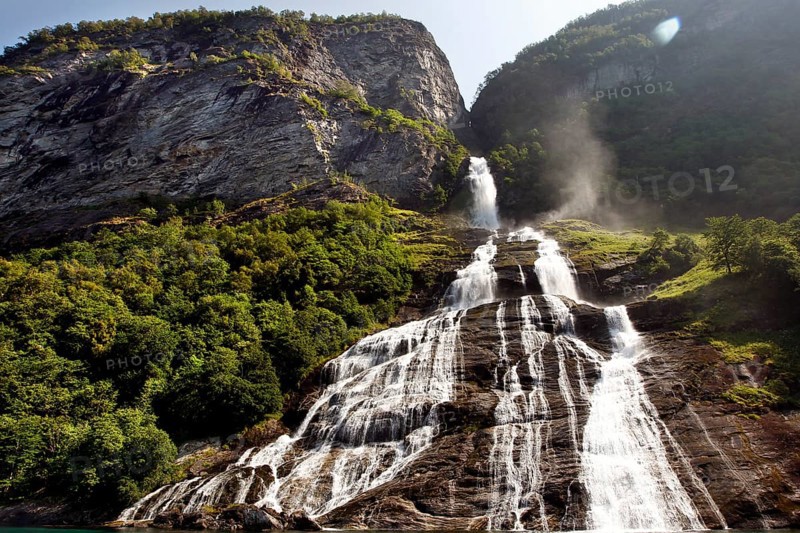 Impressive waterfall in Geirangerfjord, flowing over green cliffs, Geirangerfjord, Møre og Romsdal, Norway