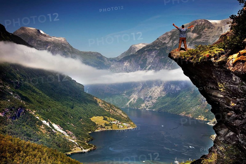 Spectacular views of the Geiranger Fjord from Flydalsjuvet with snow-capped peaks and deep water