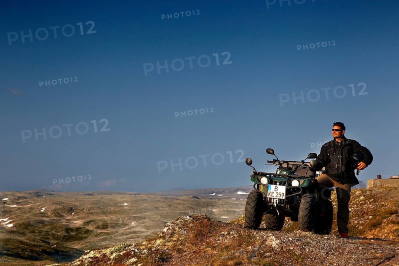 Adventurous ATV ride through the vast, barren mountains of Aurlandsfjell, Aurlandsfjell, Norway