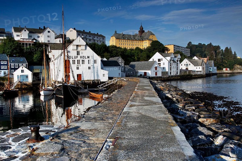 Wooden walkway at the fishing museum in Ålesund with picturesque coastal buildings, Ålesund, Norway