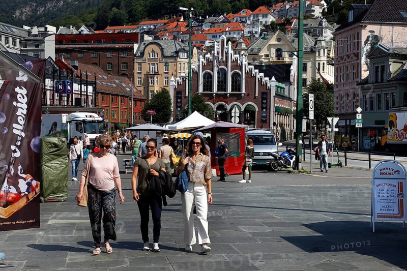 People walking through a busy street in Bergen in sunny weather, Bergen, Norway