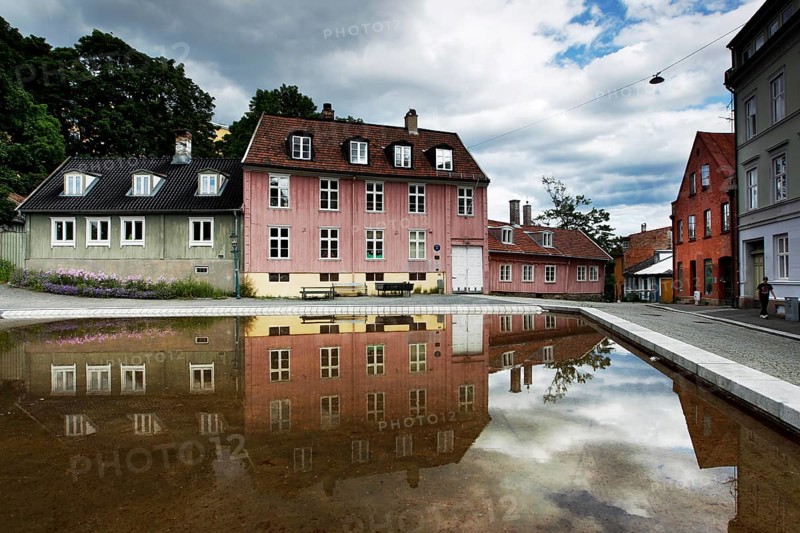 Historic wooden houses in Oslo reflected in a quiet water basin, Oslo, Damstredet, Norway