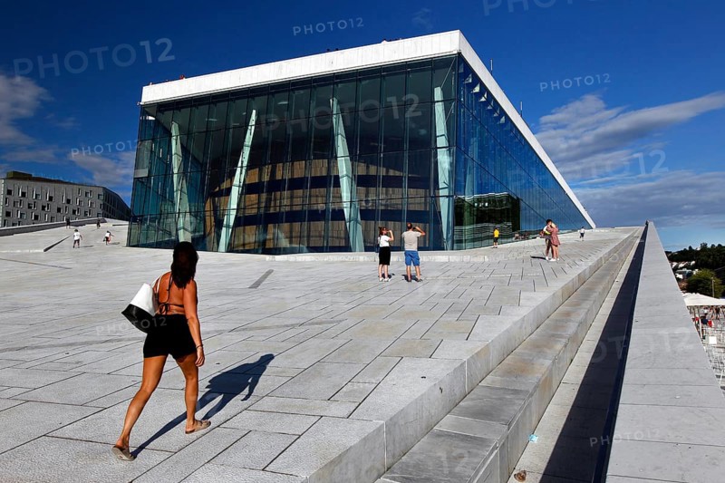 Visitors walk up the steps to the modern Oslo Opera, Oslo, Bjøvika, Norway
