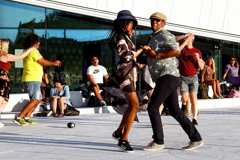 Moving dance couples dance full of energy in front of the opera in Oslo, Oslo, Bjøvika, Norway
