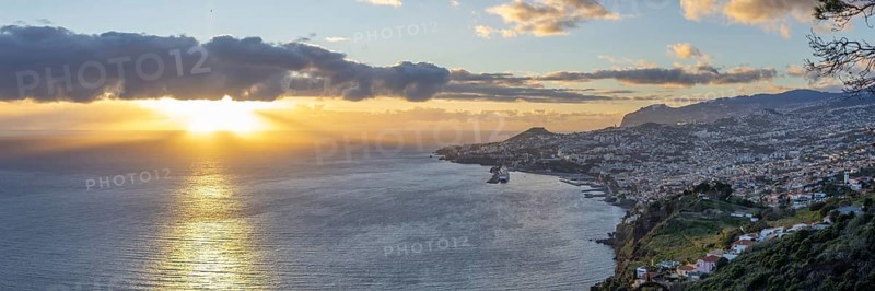 Sunset over the Atlantic Ocean, harbour with cruise ships, Funchal, Madeira, Portugal