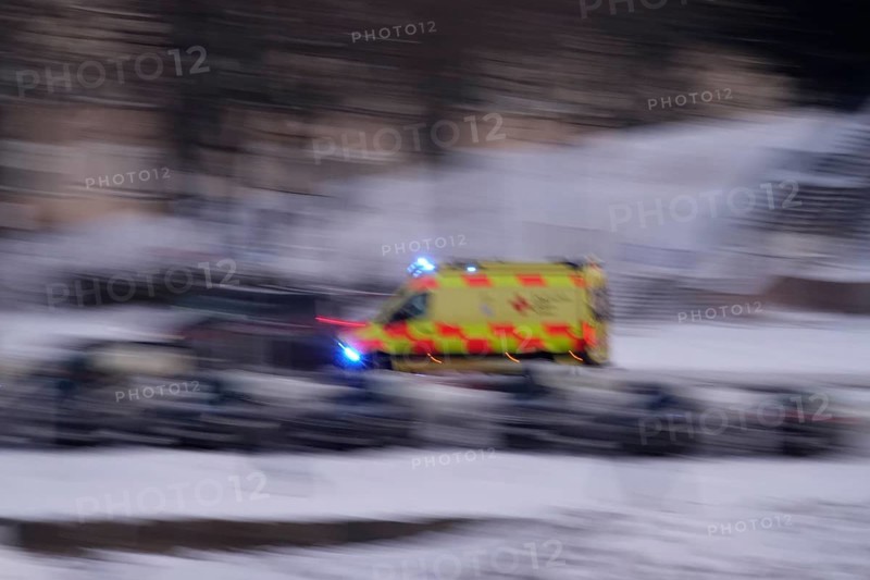 Ambulance on a road, winter, Germany