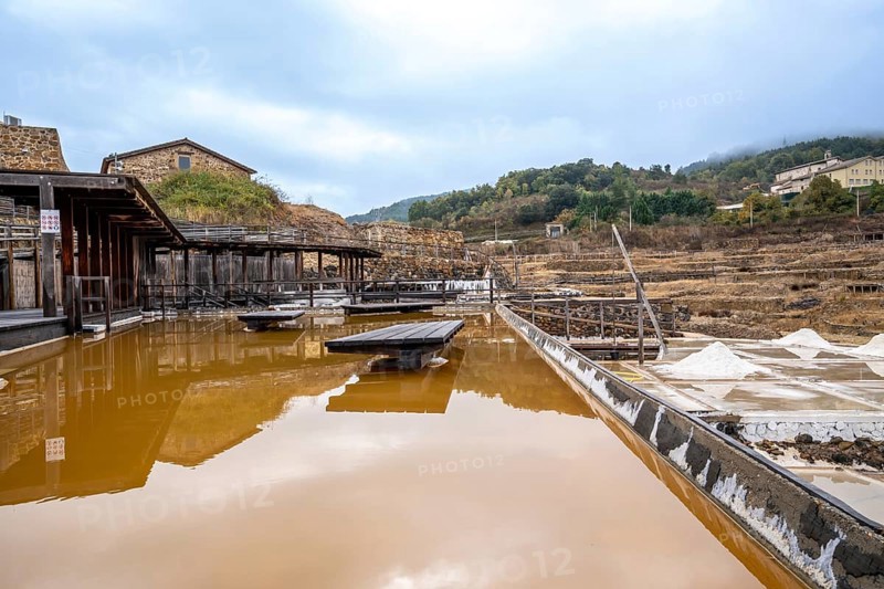 Terraced salt evaporation ponds creating a unique landscape in the historic salt valley of anana, showcasing traditional salt harvesting methods and a rich cultural heritage