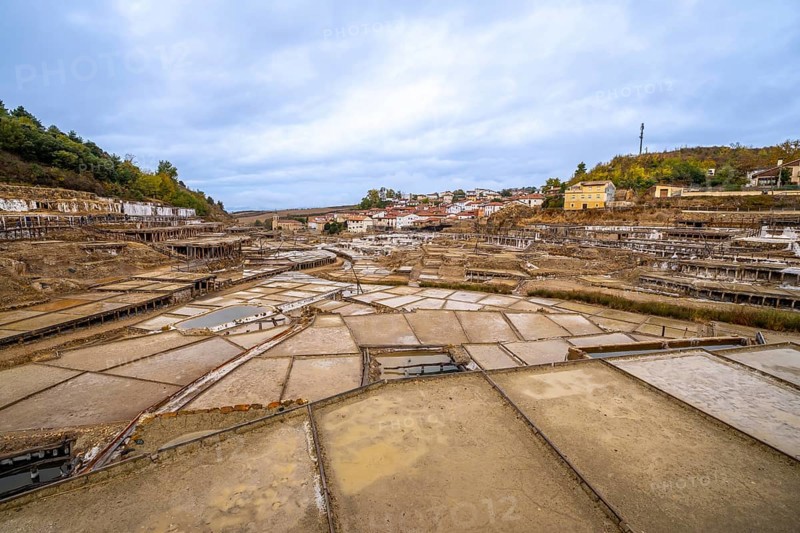 Terraced salt pans extracting and processing natural salt in the historic salt valley of anana, reflecting centuries of traditional artisanal production methods in the basque country