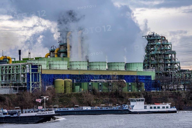 Shipping traffic on the Rhine near Duisburg-Bruckhausen, industrial setting of the ThyssenKrupp steel plant, cooler on the so-called white side of the Schwelgern coking plant, North Rhine-Westphalia, Germany