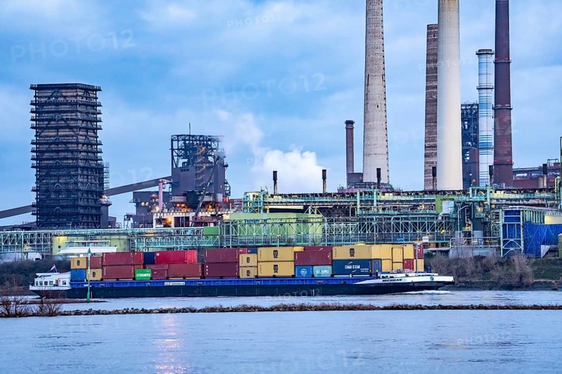 Shipping traffic on the Rhine near Duisburg-Bruckhausen, industrial setting of the ThyssenKrupp steel plant, Schwelgern coking plant, North Rhine-Westphalia, Germany