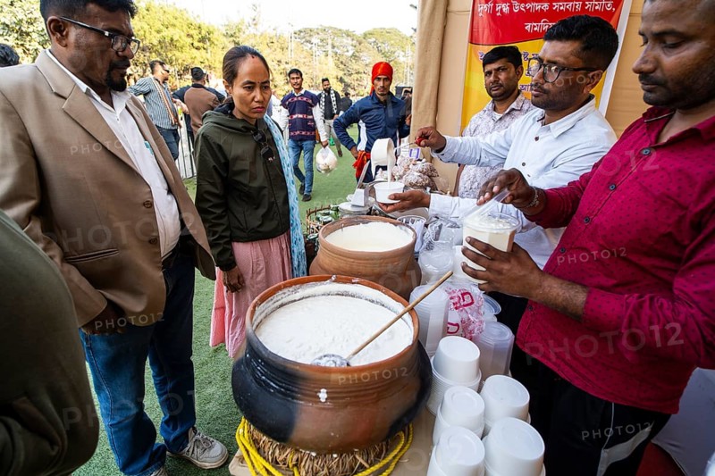 Vendor selling curd and cream dairy product at a stall in Bhogali Mela, ahead of the 'Magh Bihu' festival, in Guwahati, Assam, India on January 12, 2026. Magh Bihu, also called Bhogali Bihu, is Assam's harvest festival marking the end of the agricultural season and celebrated with feasts, community bonfires, and traditional food