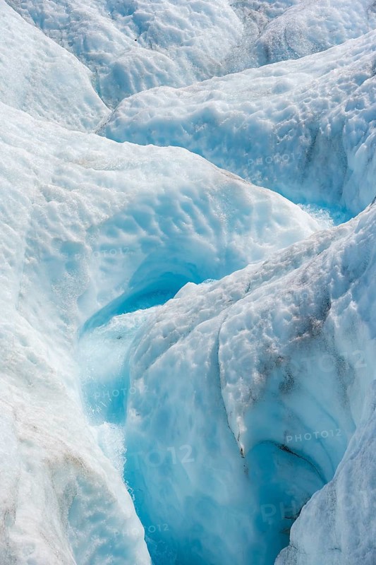 Waterfall in a crevasse on the ice of Root Glacier, Wrangell St. Elias National Park, Alaska, USA