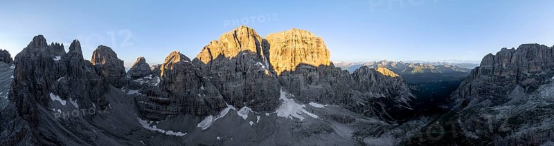 Aerial view, alpine panorama, Cima Tosa and rocky peaks at sunrise with alpine glow, picturesque mountain landscape, Brenta Dolomites, Trentino, Italy