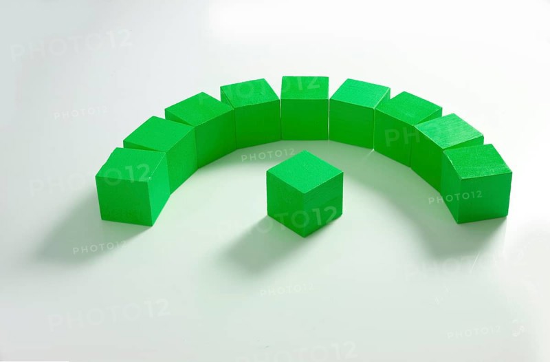 10 green wooden cubes against a white background