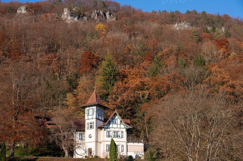 Historic villa in mixed autumn forest in Franconian Switzerland, Muggendorf, Upper Franconia, Bavaria, Germany