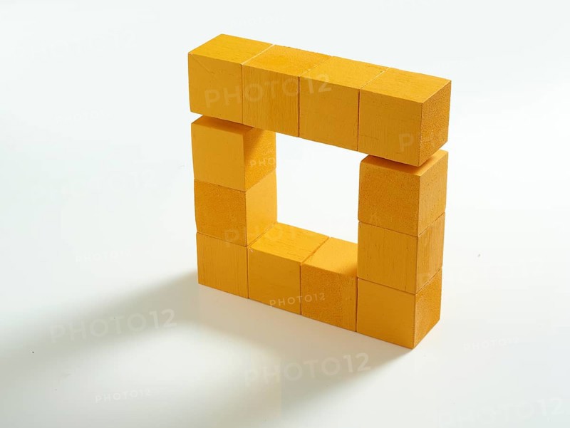 12 yellow wooden cubes against a white background