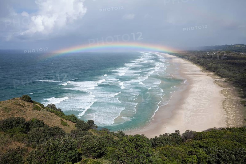 Tallow Beach bay with rainbow, lookout Byron Bay lighthouse, New South Wales, Australia