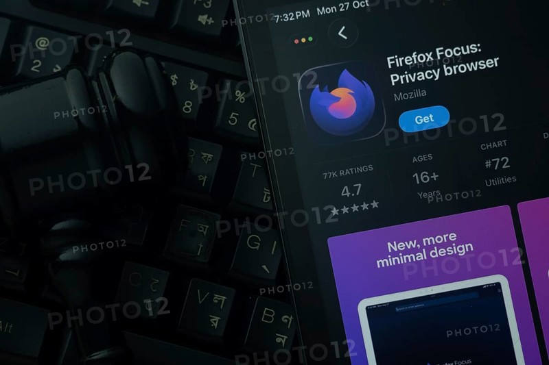 Dhaka, Bangladesh- 28 Oct 2025: An iPad displaying the Firefox Focus app against a judge's gavel and dark keyboard background