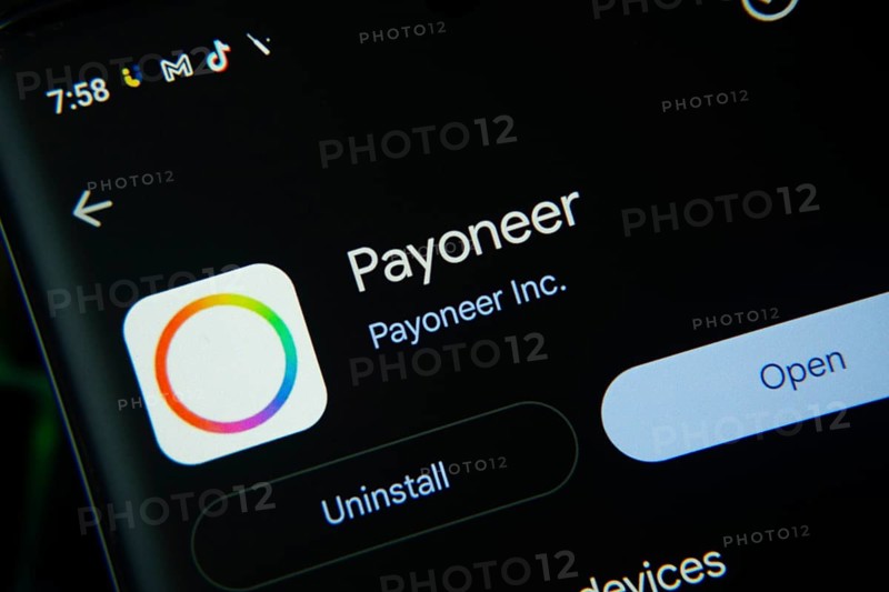 Dhaka, Bangladesh- 27 July 2025: Screen displaying Payoneer app with open and uninstall options, dark interface