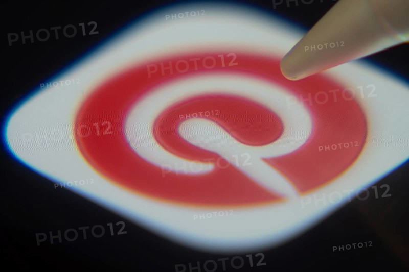 Dhaka, Bangladesh- 06 Dec 2025: Close-up of the Pinterest app on a screen with a stylus pointing at it