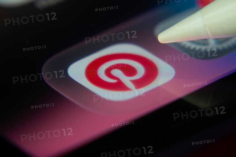 16 Nov 2025- Dhaka, Bangladesh: Stylus touching the Pinterest app icon on a smartphone screen