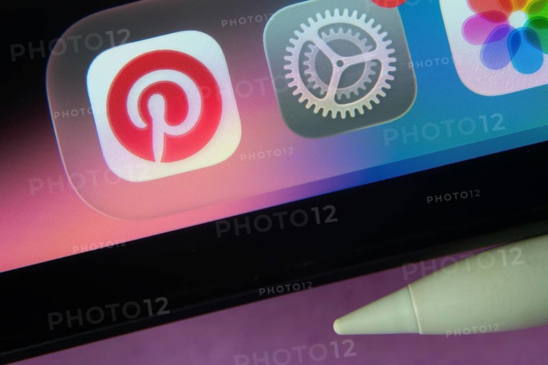 16 Nov 2025- Dhaka, Bangladesh: Pinterest and other app icons with a digital pen on a iPad screen