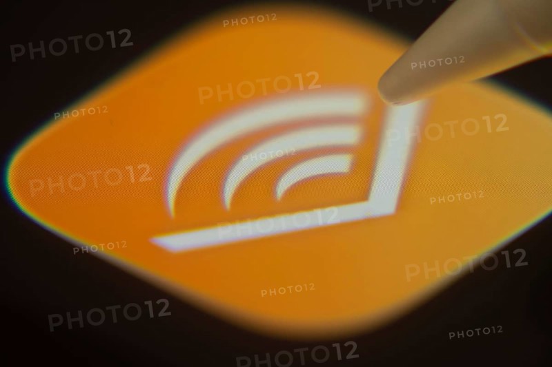 Dhaka, Bangladesh- 06 Dec 2025: Close-up of the Audible app on a screen with a stylus pointing at it