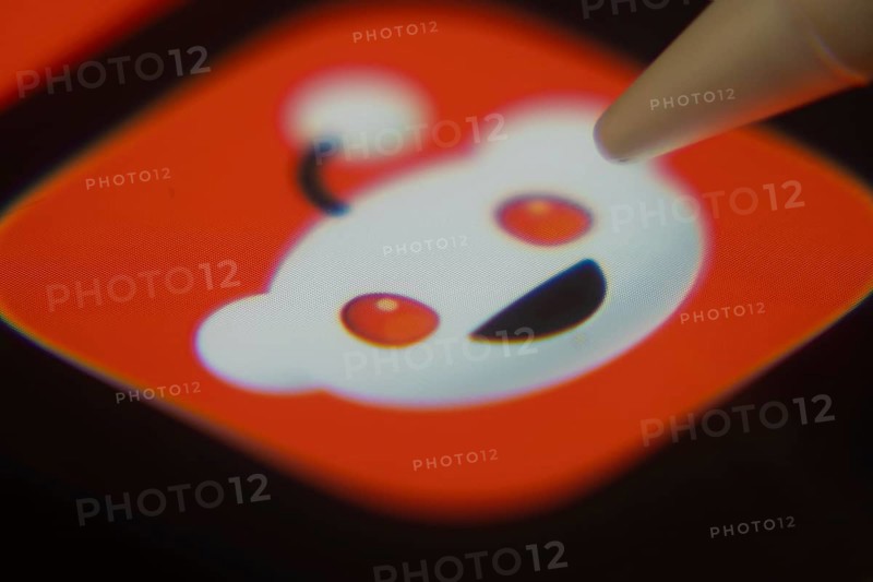 Dhaka, Bangladesh- 06 Dec 2025: Close-up of the Reddit app on a screen with a stylus pointing at it