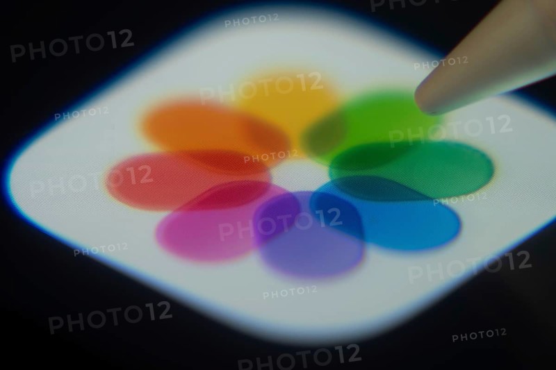 Dhaka, Bangladesh- 06 Dec 2025: Close-up of the Apple Photos app on a screen with a stylus pointing at it
