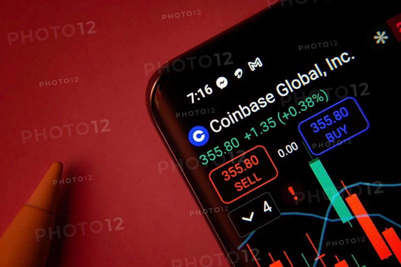 Dhaka, Bangladesh- 08 Sep 2025: Close-up of a phone screen showing Coinbase Global Inc stock market data with a candlestick chart