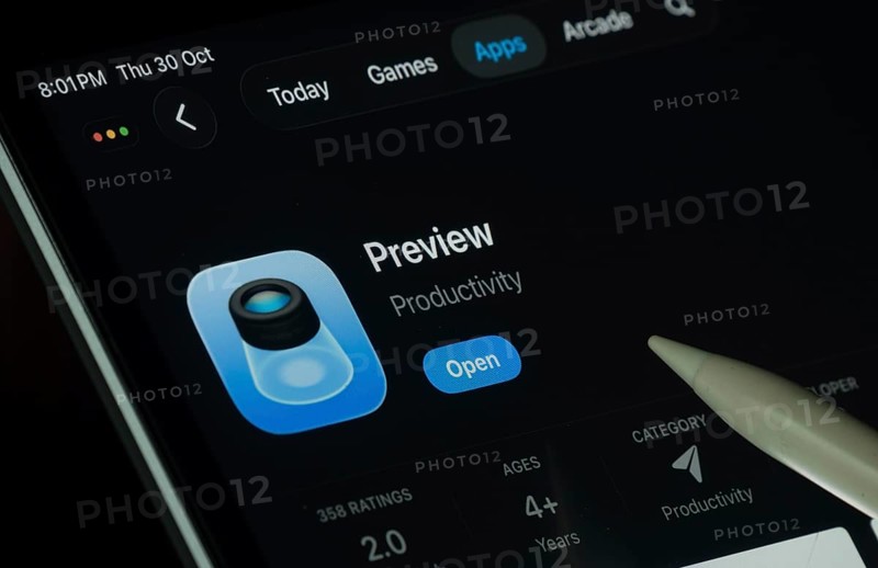 Dhaka, Bangladesh- 30 Oct 2025: Apple Preview app displayed on a iPad screen in dark mode with a digital pen pointing at it