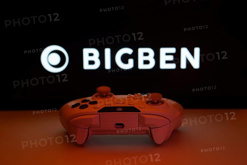 Dhaka, Bangladesh- 08 Apr 2025: A gaming controller in front of a Bigben Interactive screen