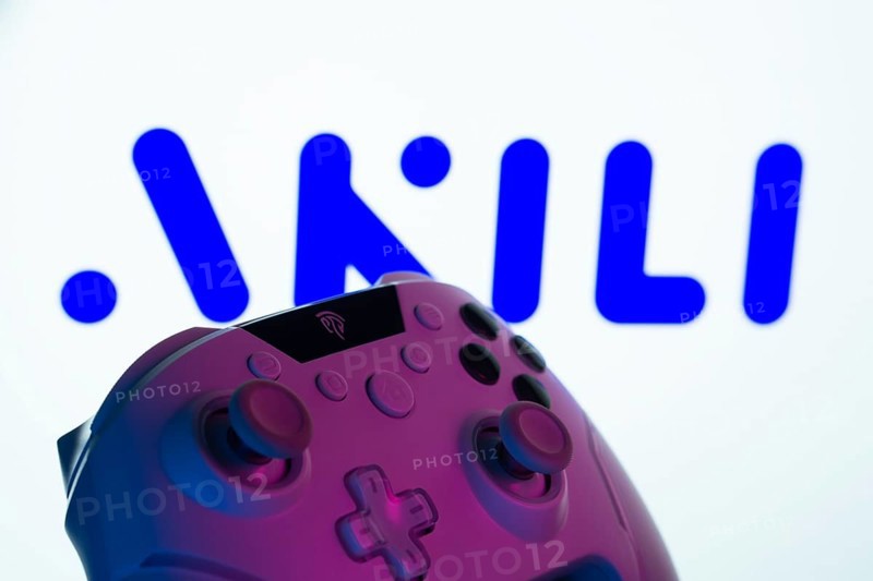 Dhaka, Bangladesh- 20 Mar 2025: A close-up of a gamepad with the Akili Interactive seen on screen in the background