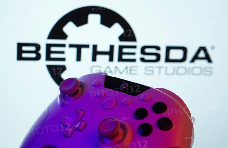Dhaka, Bangladesh- 20 Mar 2025: A close-up of a gamepad with the Bethesda Game Studios seen on screen in the background