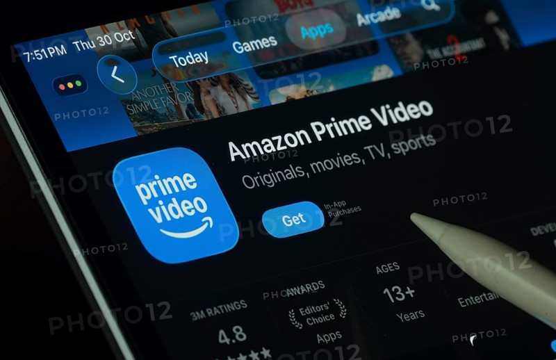 Dhaka, Bangladesh- 30 Oct 2025: Amazon Prime Video app displayed on a iPad screen in dark mode with a digital pen pointing at it