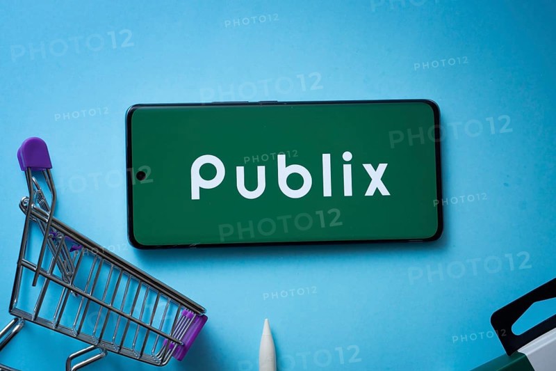 Dhaka, Bangladesh- 03 July 2025: Smartphone displaying Publix logo with shopping cart on a blue background