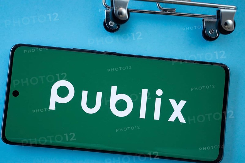 Dhaka, Bangladesh- 03 July 2025: Smartphone screen showing the Publix logo with shopping cart wheels on a blue background