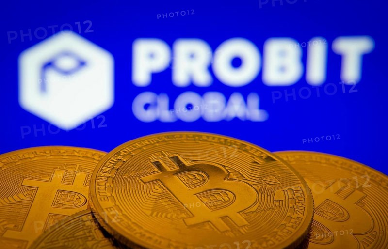 Dhaka, Bangladesh- 27 Mar 2025: Close-up of Bitcoin coins with the ProBit Global logo visible on a screen in the background