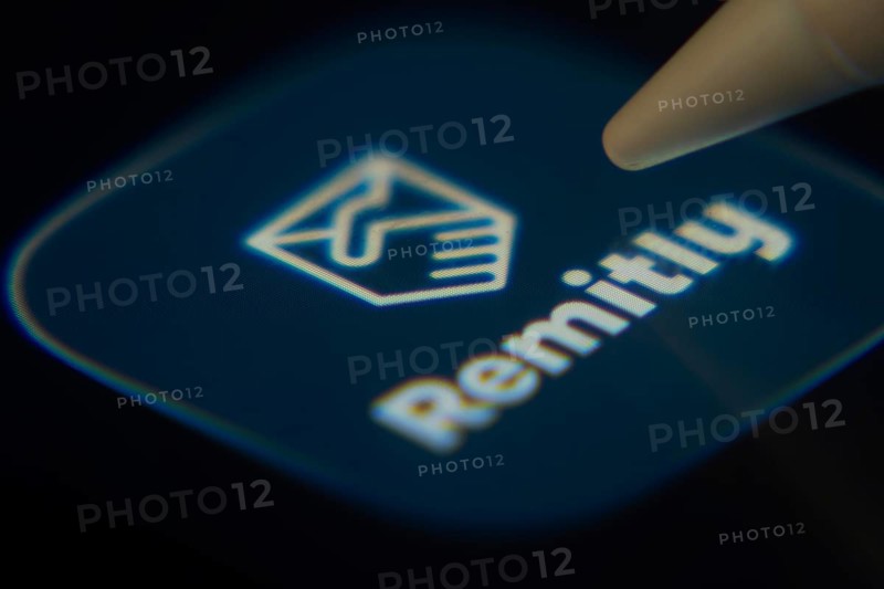Dhaka, Bangladesh- 06 Dec 2025: Close-up of the Remitly app on a screen with a stylus pointing at it