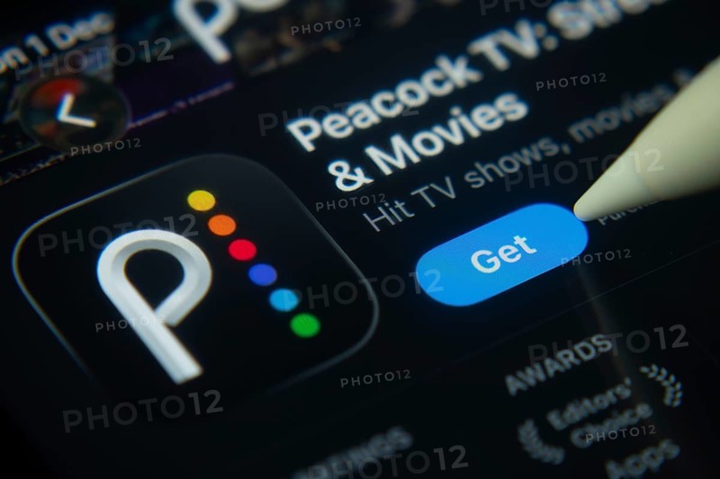 Dhaka, Bangladesh- 01 Dec 2025: A close-up of the Peacock TV app icon in the App Store on an iPad screen